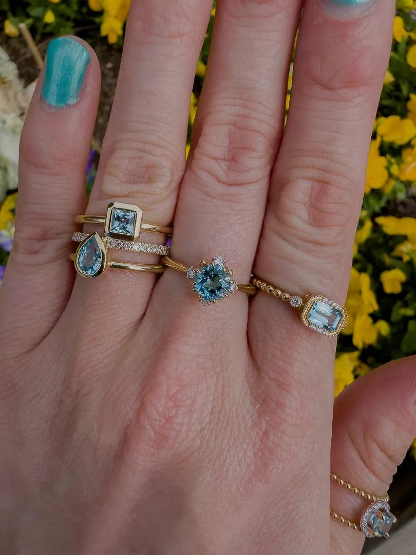 Bezel Set Blue Topaz and Diamond Ring