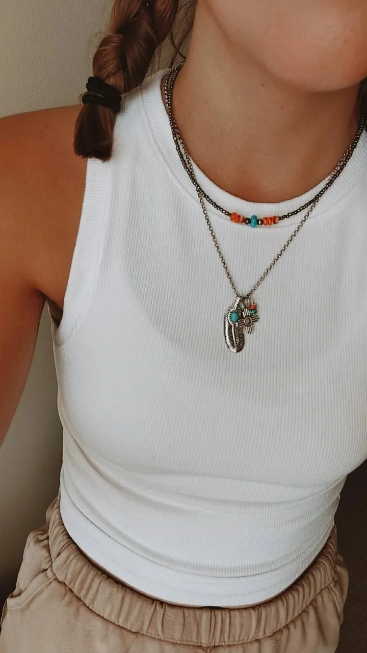 Feather in her halo charmed necklace